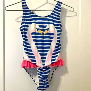 An adorable girls swan bathing suit
